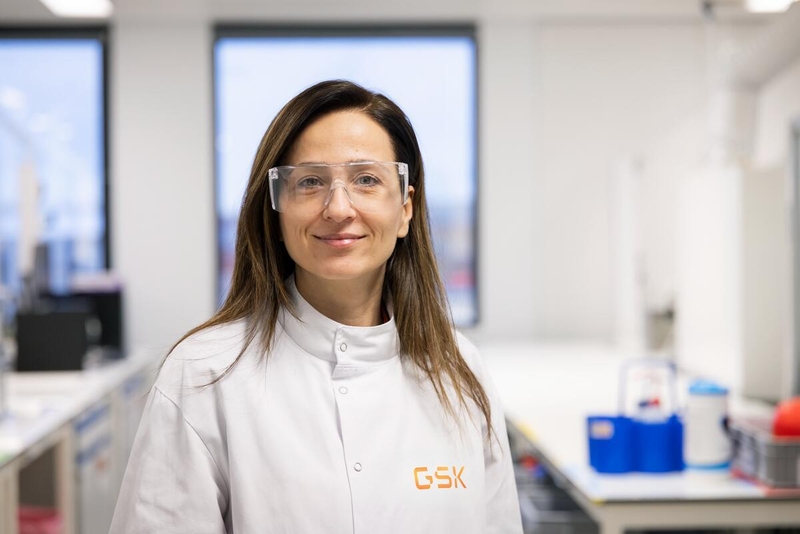 Scientist wearing safety glasses looking at camera