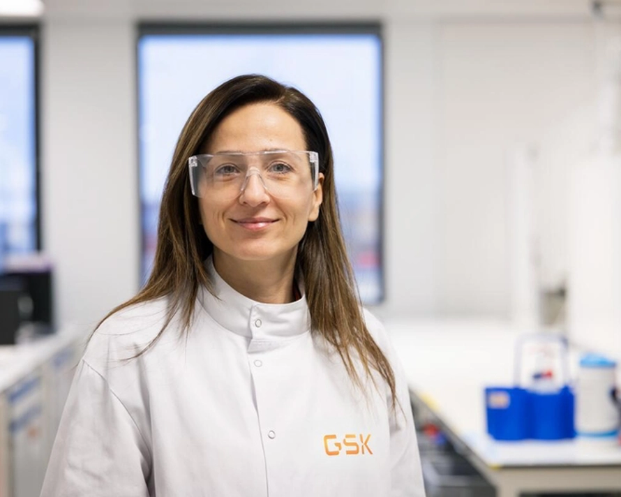 Scientist wearing safety glasses looking at camera